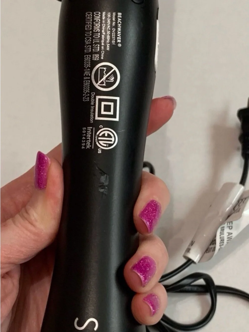 The Beachwaver Co. S1 Curling Wand in Black and Silver